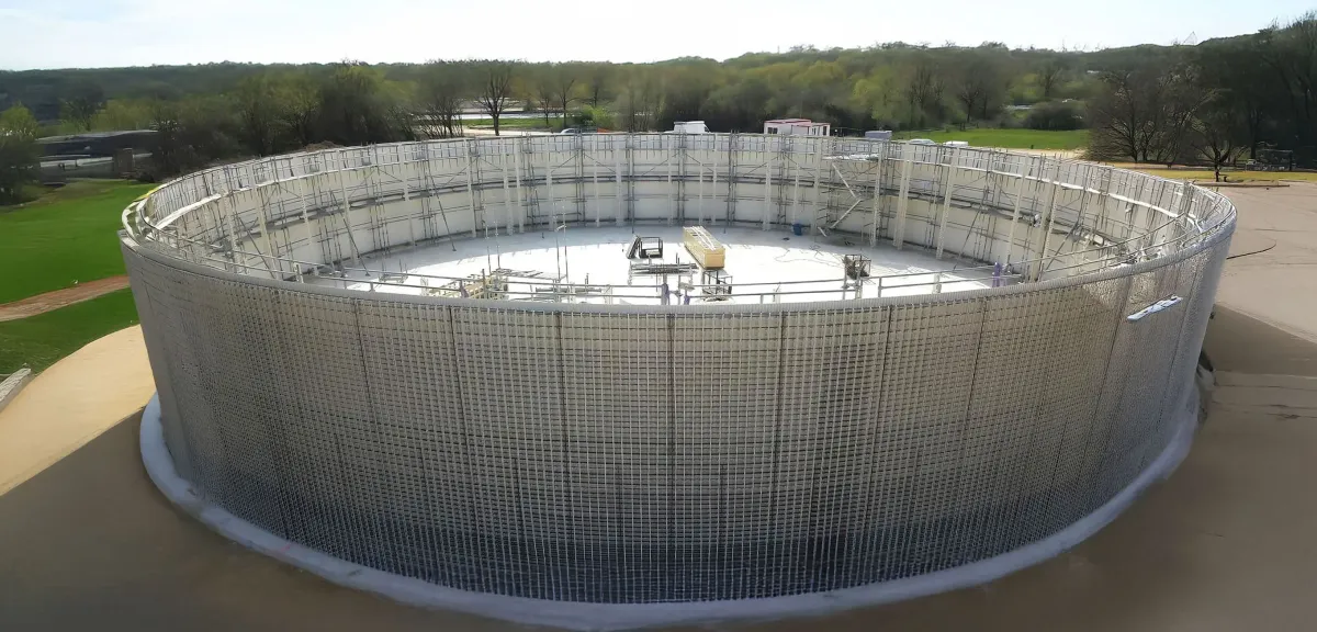 A large, cylindrical biogas digester with a domed top, built with the Advantage Formwork system, designed for converting organic waste into renewable energy.